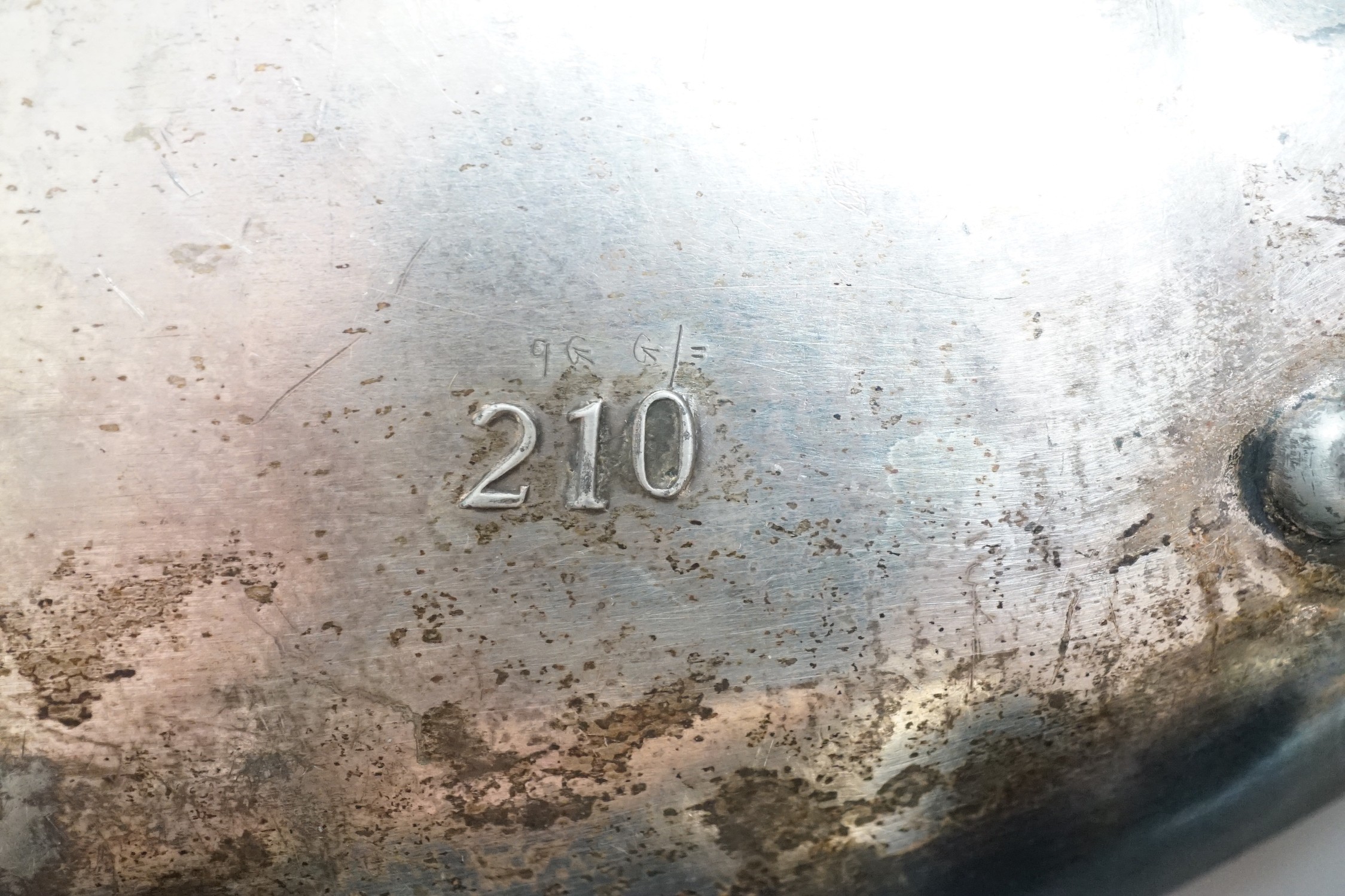 An unmarked, (possibly WMF) stamped 210 on base, an Art Nouveau pewter dish with a child admiring a snail. 27cm wide